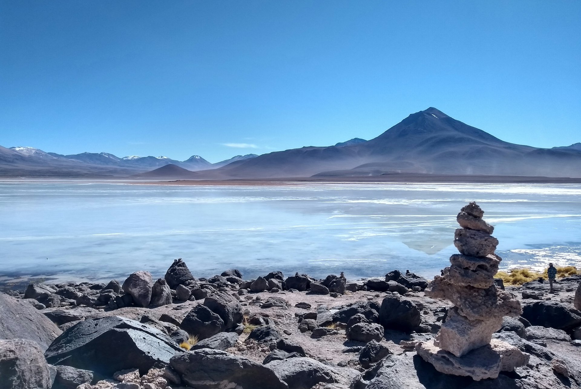 a stack of rocks sitting on top of a rocky beach